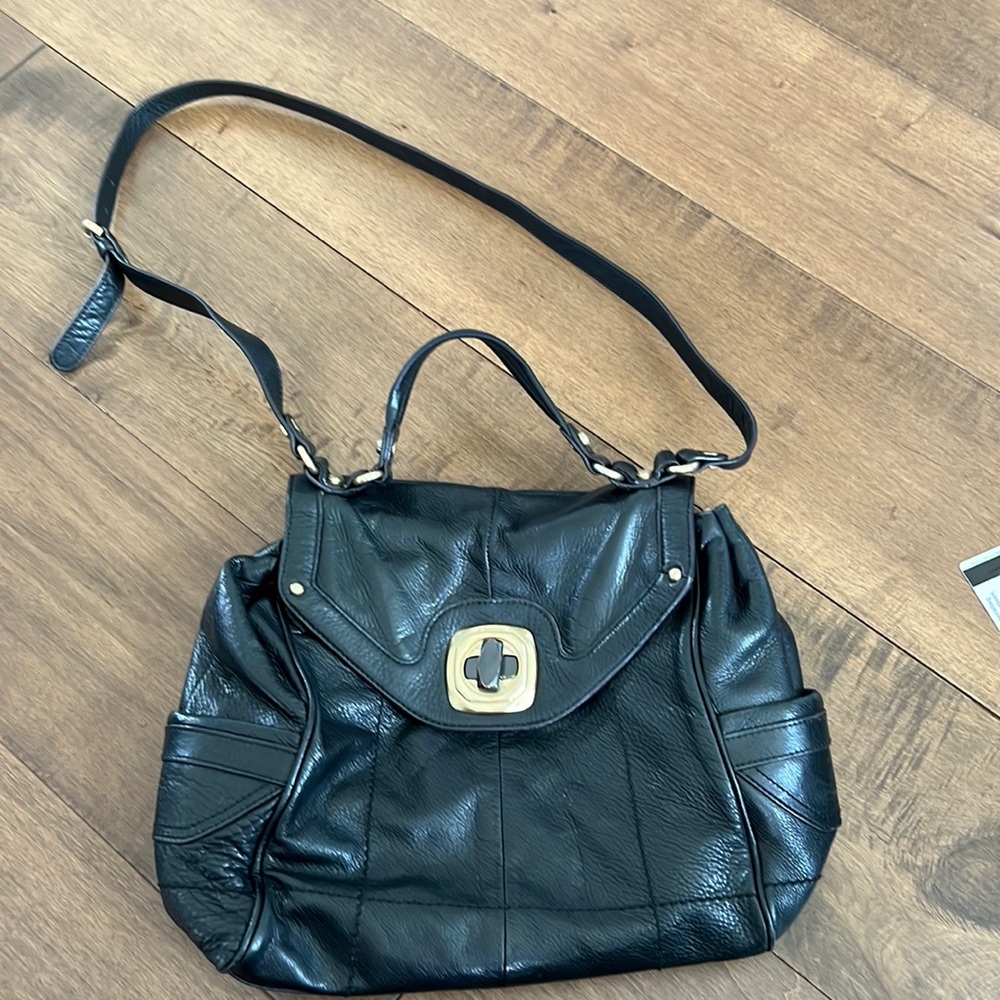 B. Makowsky black and gold leather bag